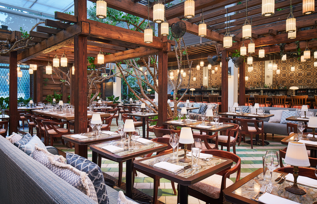 An open-roofed restaurant with hanging lanterns